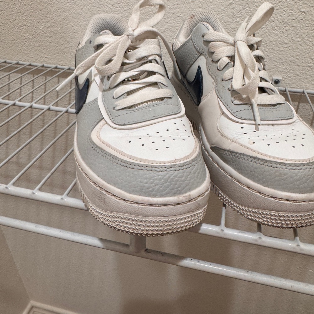 Nike White Sneakers with Blue Logo